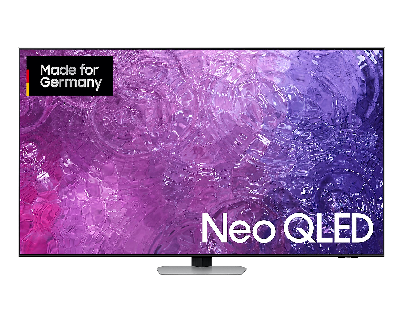 Telewizor Samsung Neo QLED na stojaku, z fioletowo-różowym wzorzystym tłem.