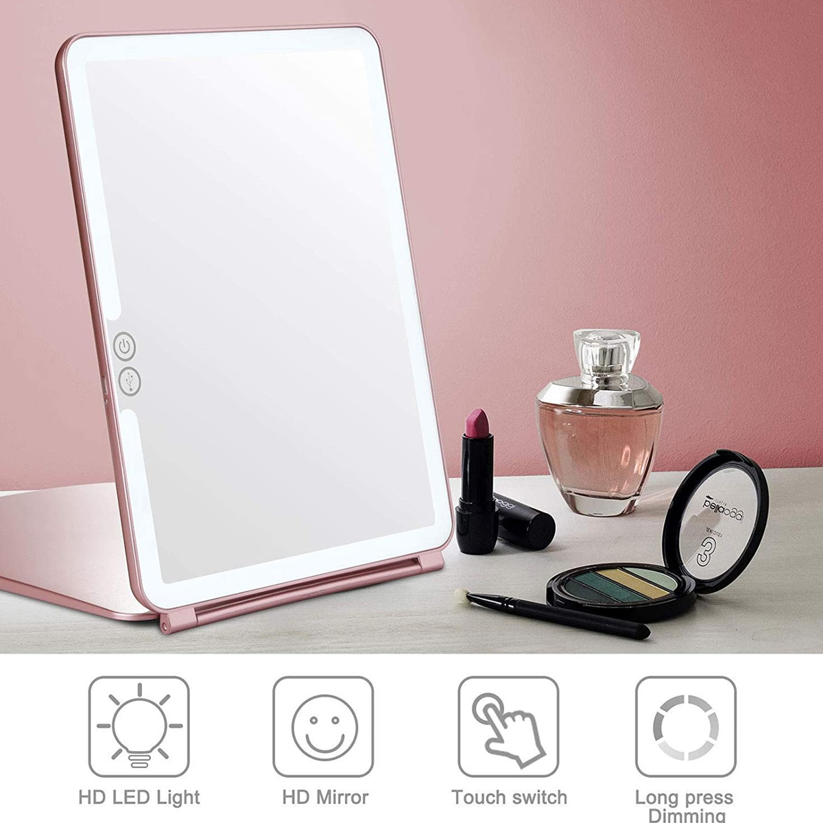 Ein rosa Schminkspiegel mit LED-Leuchten, Lippenstift, Parfüm und Make-up. Touch-Schalter.