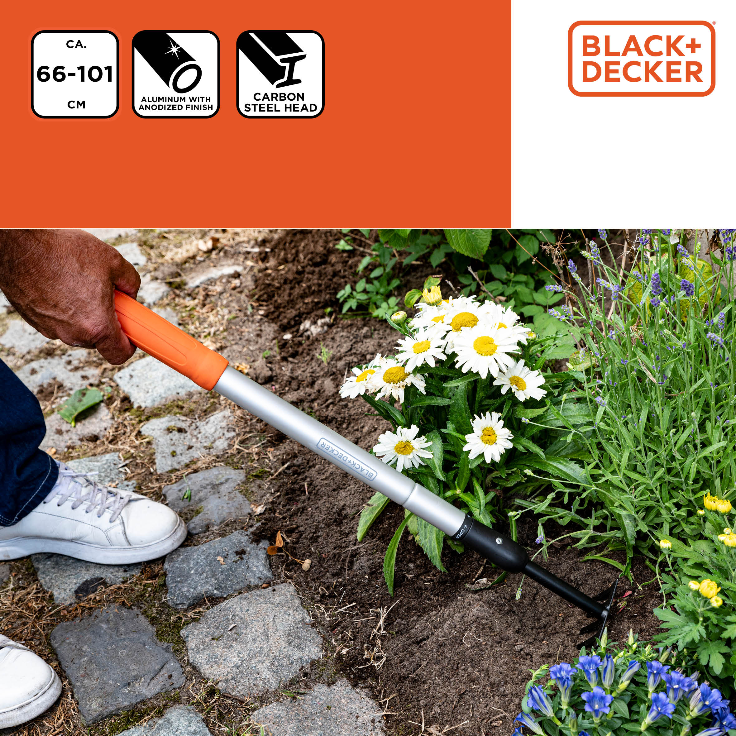 Person using a BLACK+DECKER garden tool. The tool has an aluminum shaft.