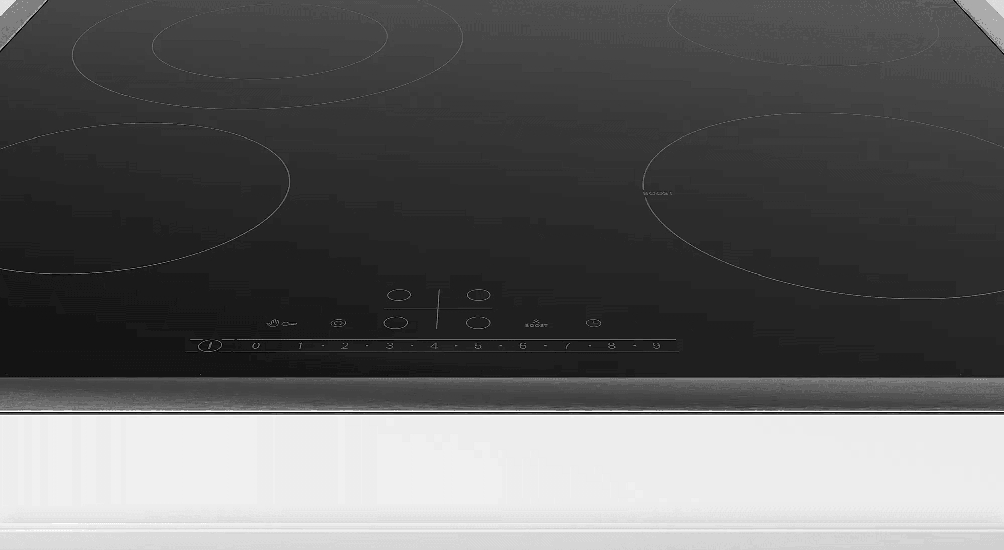 Table de cuisson à induction noire, quatre zones de cuisson circulaires, commandes tactiles.