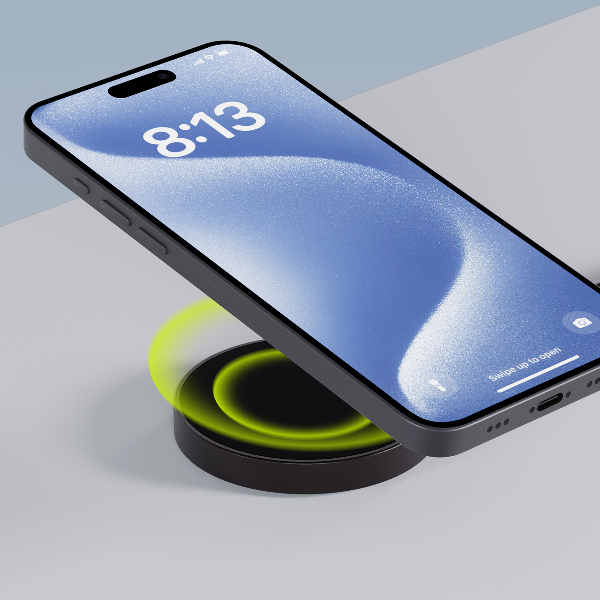 Czarny telefon na ładowarce bezprzewodowej. Telefon wyświetla godzinę. Zielone światło wokół ładowarki.