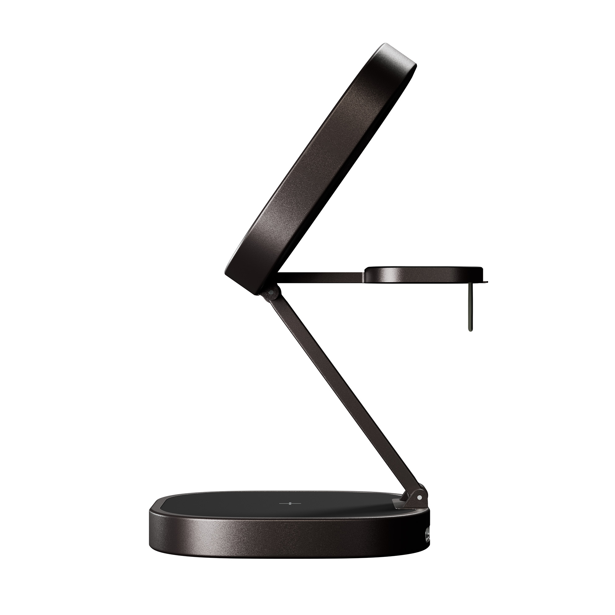 Ciemna lampa biurkowa z okrągłą podkładką ładującą i uchwytem na telefon.