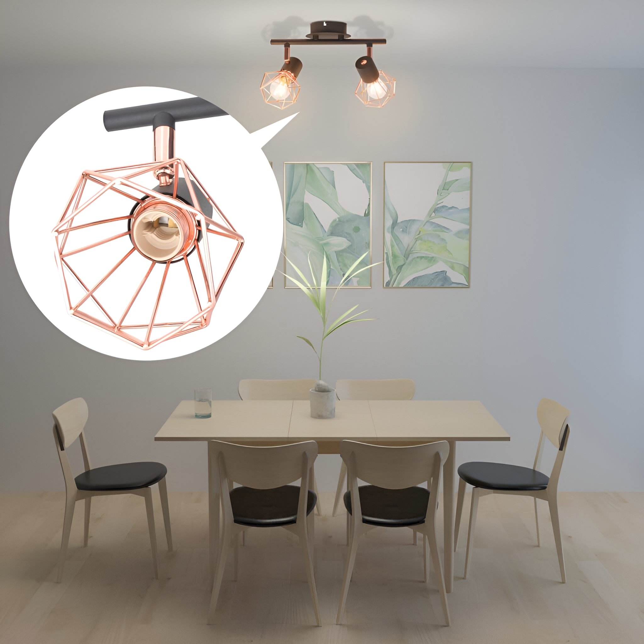 Ein Esszimmer mit einer Spotleuchte mit geometrischem Lampenschirm und zwei Drucken an der Wand.