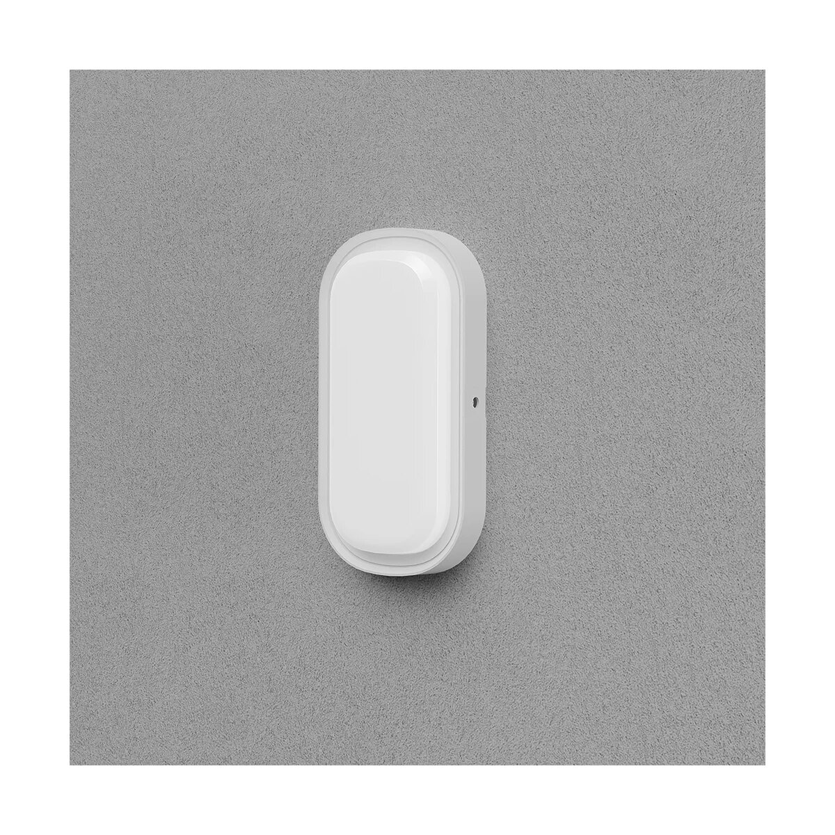 Weiße, ovale Wandleuchte. An einer grau strukturierten Wand montiert. Schlichtes und modernes Design.