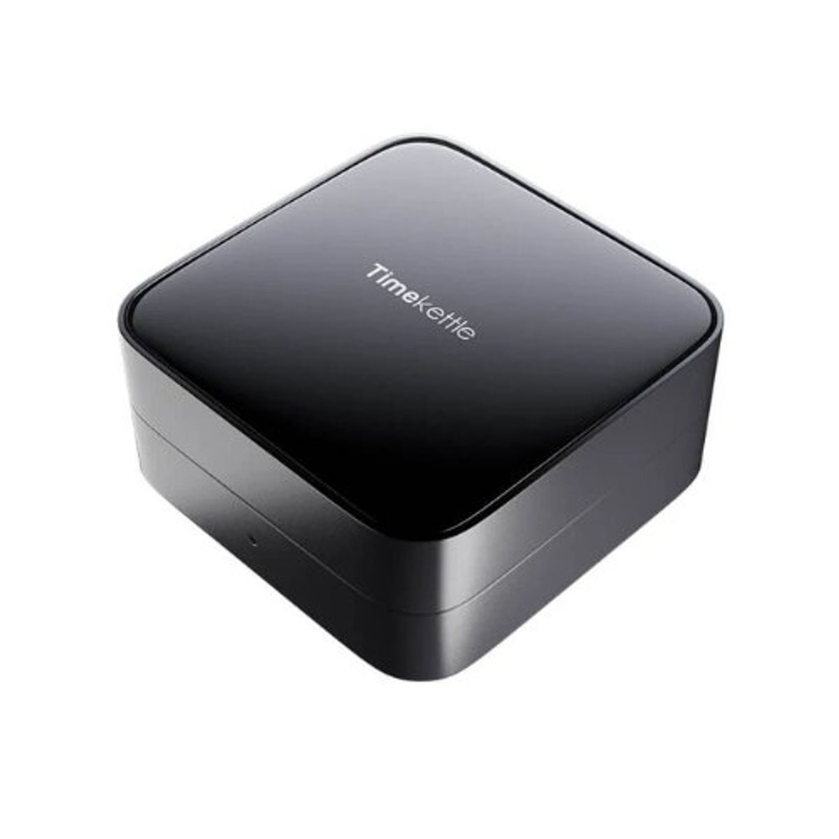 Dispositivo Timekettle negro. Es un dispositivo cuadrado. El dispositivo está sobre un fondo blanco.