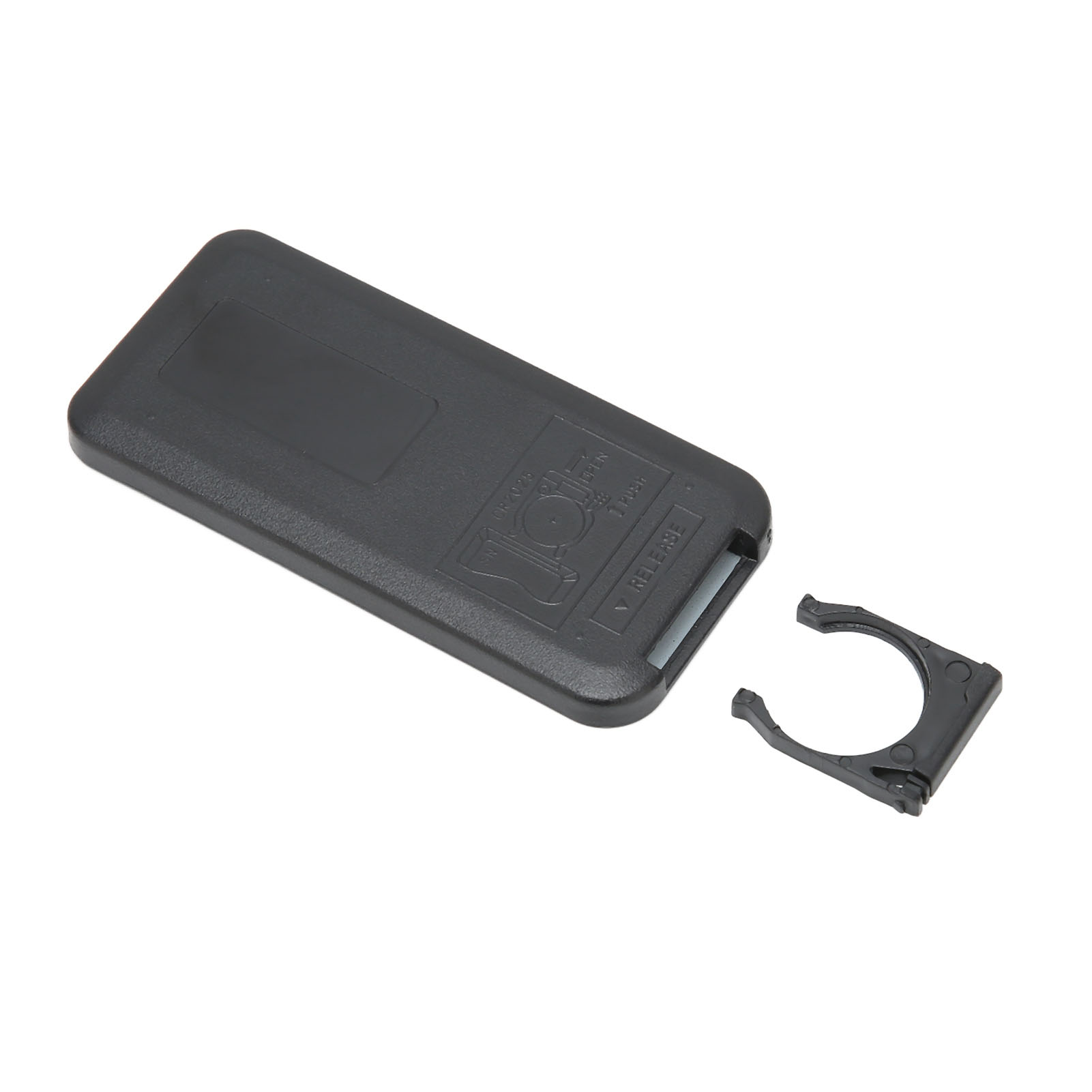 Schwarze Fernbedienung und ein schwarzer Clip. Die Fernbedienung ist geöffnet.