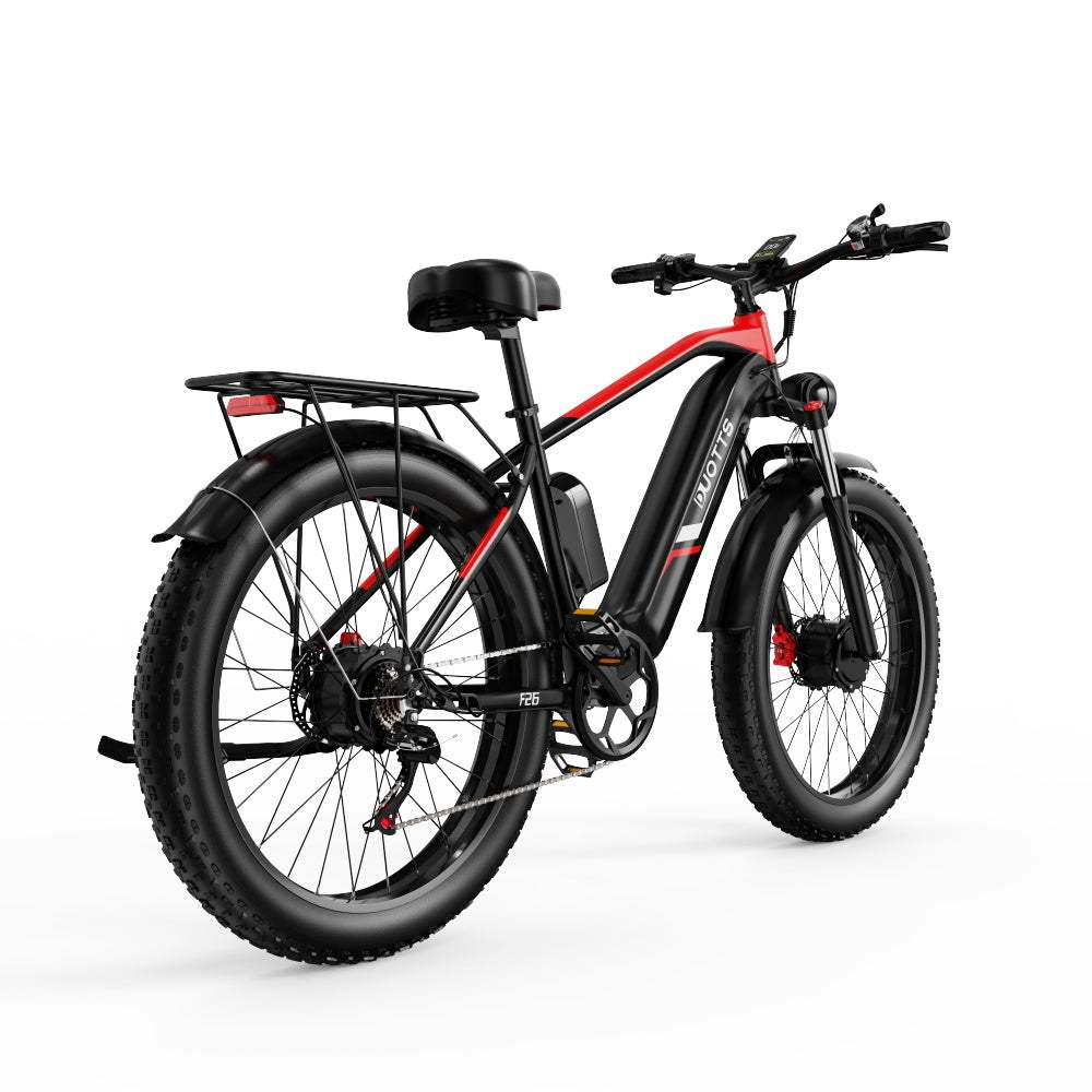 Bicicletta elettrica nera e rossa con pneumatici spessi. Ha un portapacchi e una batteria.