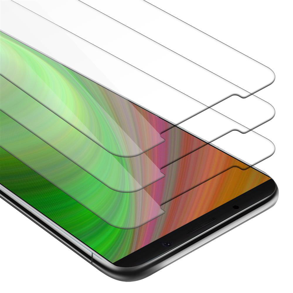 Tre proteggi schermo su uno schermo del telefono. Strati di verde, arancione e bianco. Schermo del telefono visibile.