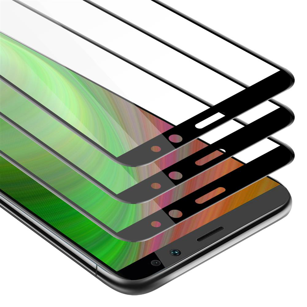 Primer plano de pantallas de teléfono con protectores aplicados, mostrando un fondo verde y blanco en la pantalla.