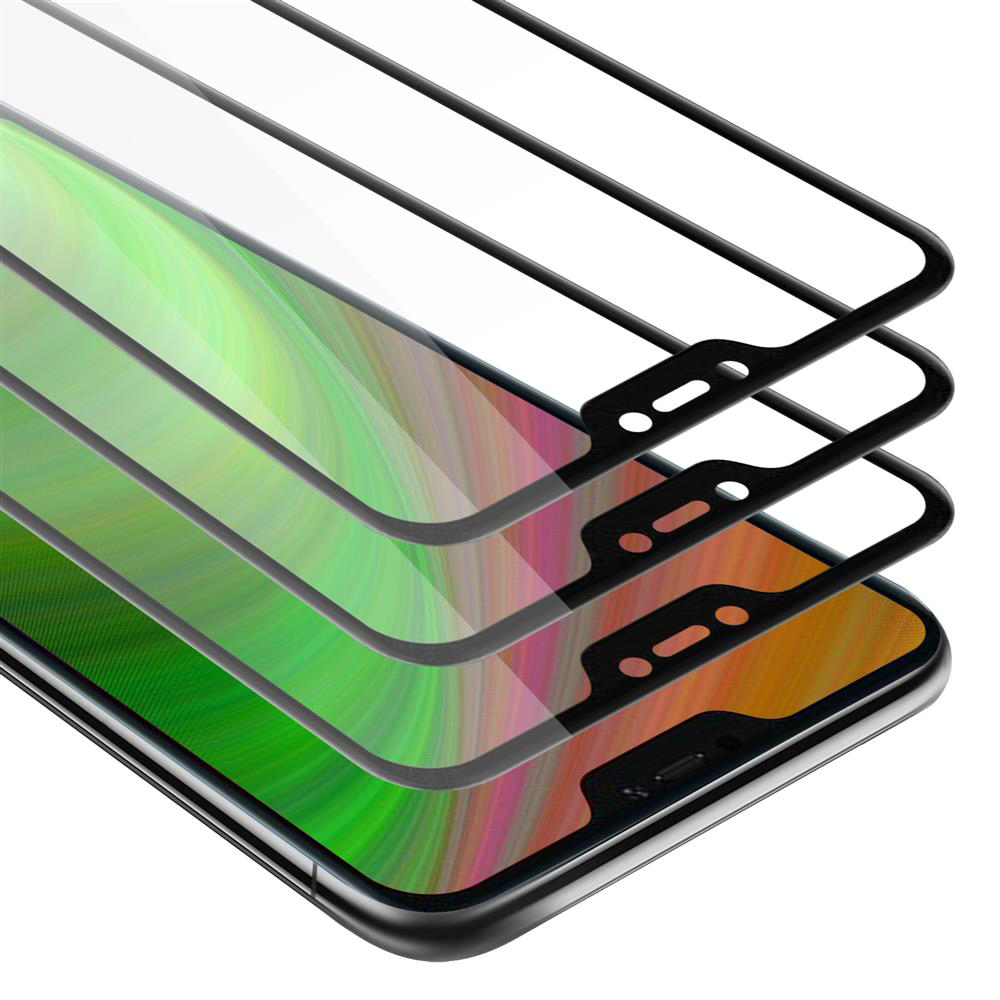 Un telefono con diverse protezioni per lo schermo sopra. Lo schermo del telefono è visibile.