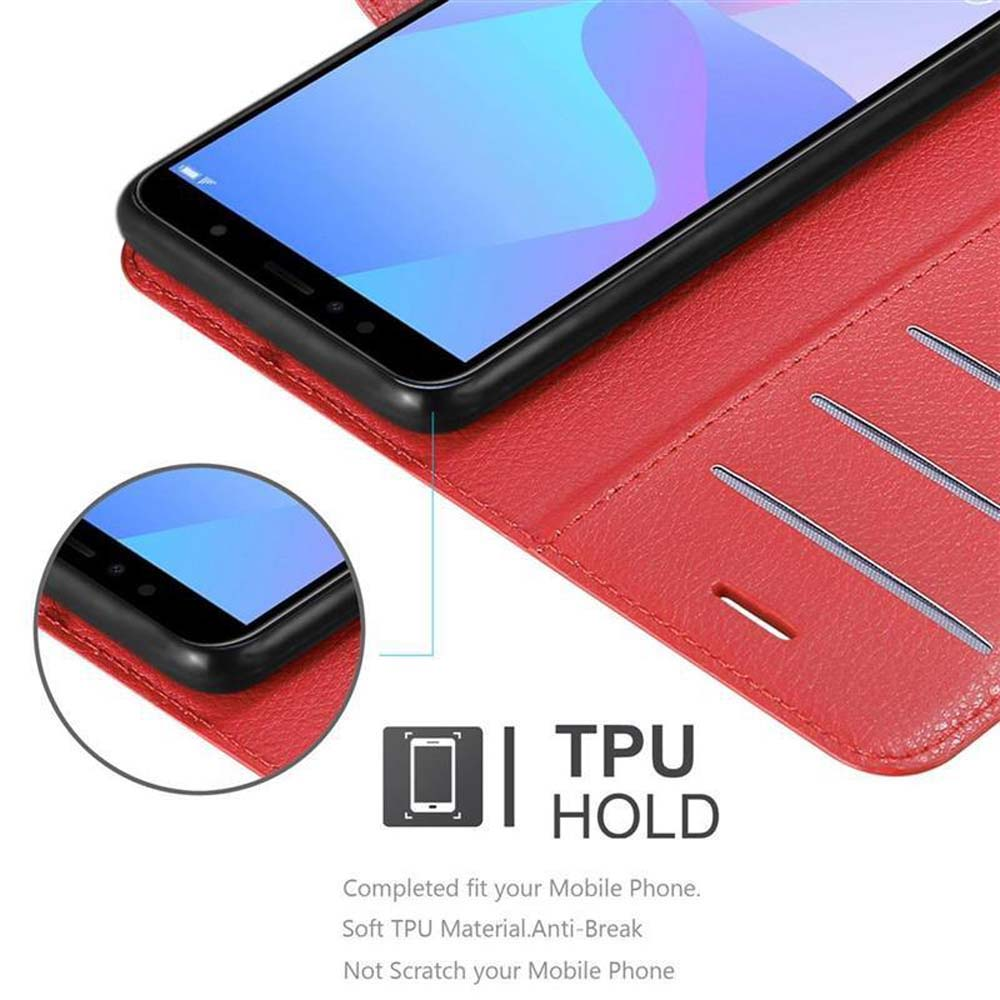 Una custodia rossa per telefono tiene un telefono nero, con un primo piano dell'angolo.