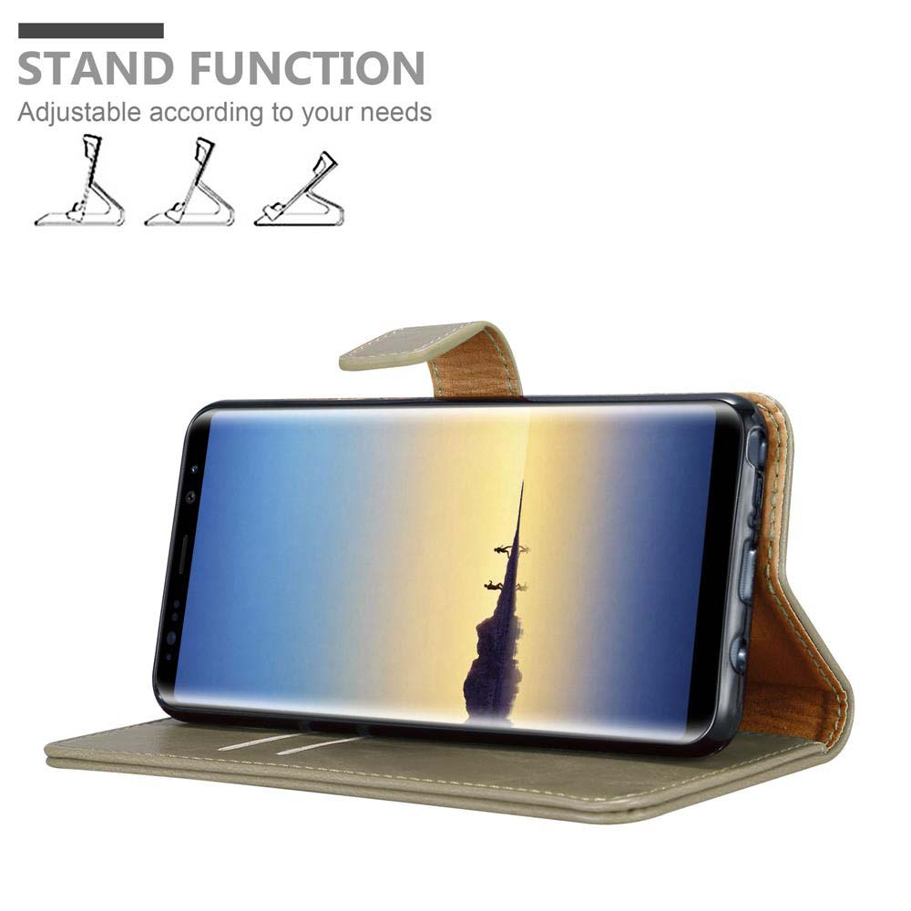 Un telefono in una custodia. La custodia può stare in piedi. Il telefono è di lato.