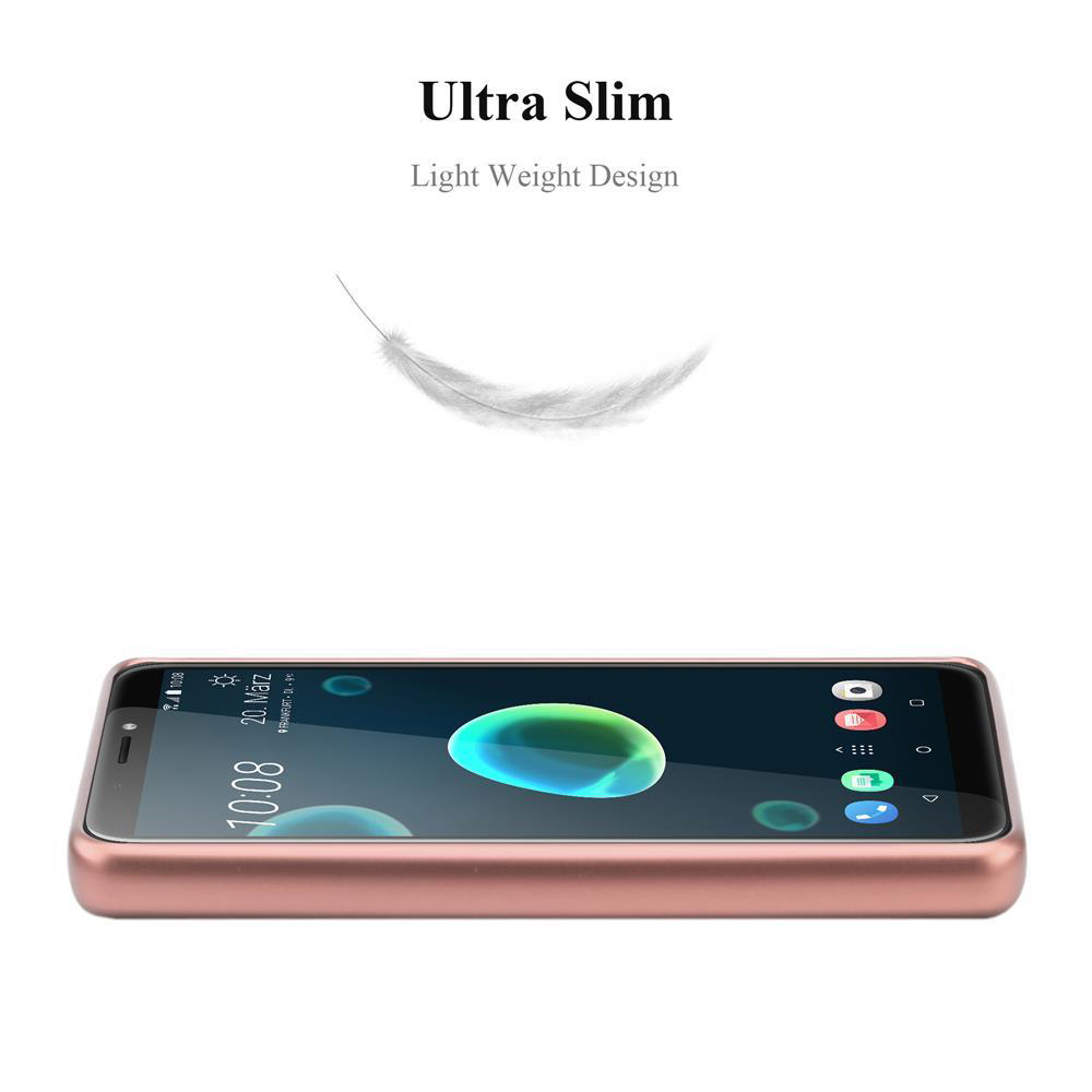 Una custodia per telefono color oro rosa con un telefono all'interno. Una piuma fluttua sopra il telefono.