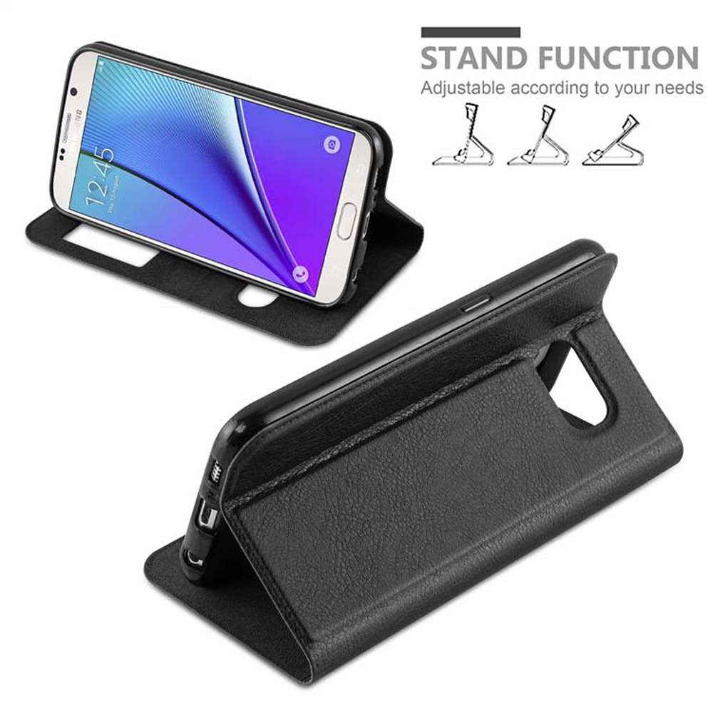 Schwarze Handyhülle mit Telefon auf einem Tisch, im Standmodus. Text: 'STAND FUNCTION'.