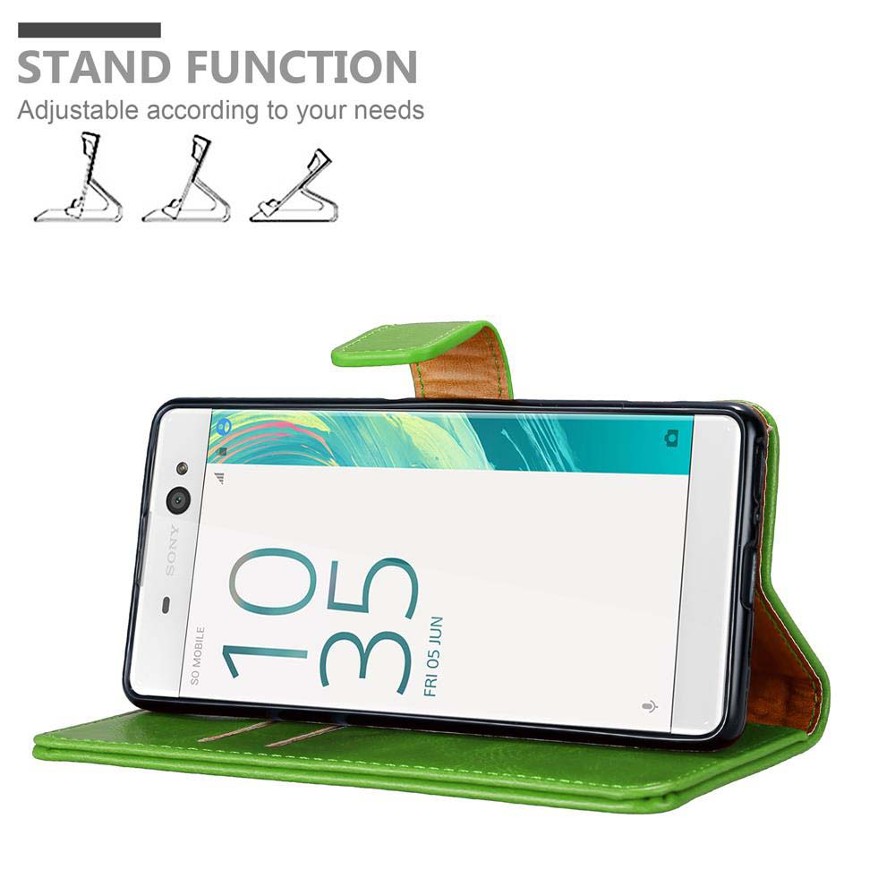 Funda verde con teléfono mostrando hora. Iconos y texto en pantalla.