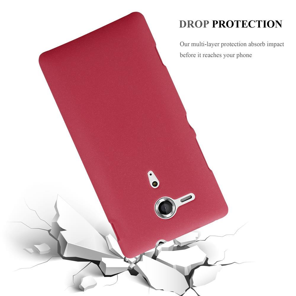 Una funda de teléfono roja con grietas debajo. Texto: 'DROP PROTECTION' y 'Nuestra protección multicapa absorbe el impacto'.