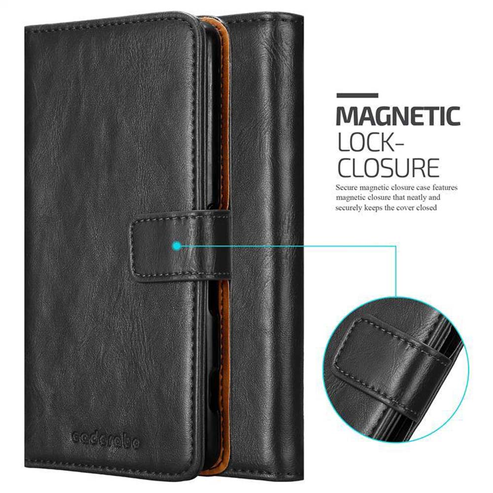 Custodia nera, che mostra la chiusura magnetica. Testo: Chiusura magnetica.