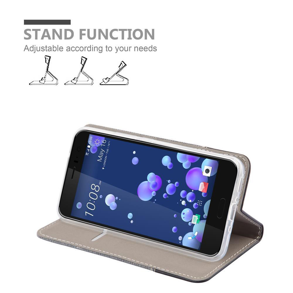 Telefono in una custodia aperta, che mostra la funzione stand. Il testo dice 'STAND FUNCTION' e schermo.