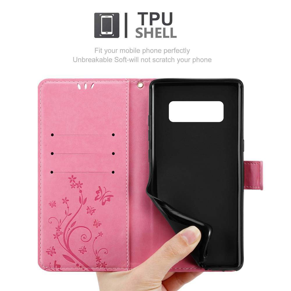 Una custodia per telefono rosa con un design floreale, aperta per rivelare un telefono nero. Una mano tiene il telefono.