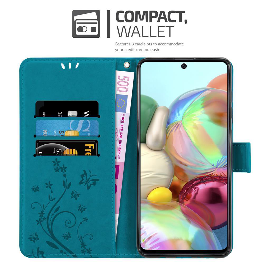 Una custodia a portafoglio per telefono verde acqua è aperta, con carte e denaro visibili. Presenta un design floreale.