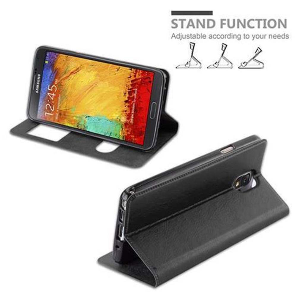 Teléfono en una funda. La funda está doblada. El texto muestra la funcionalidad del soporte. Fondo blanco.