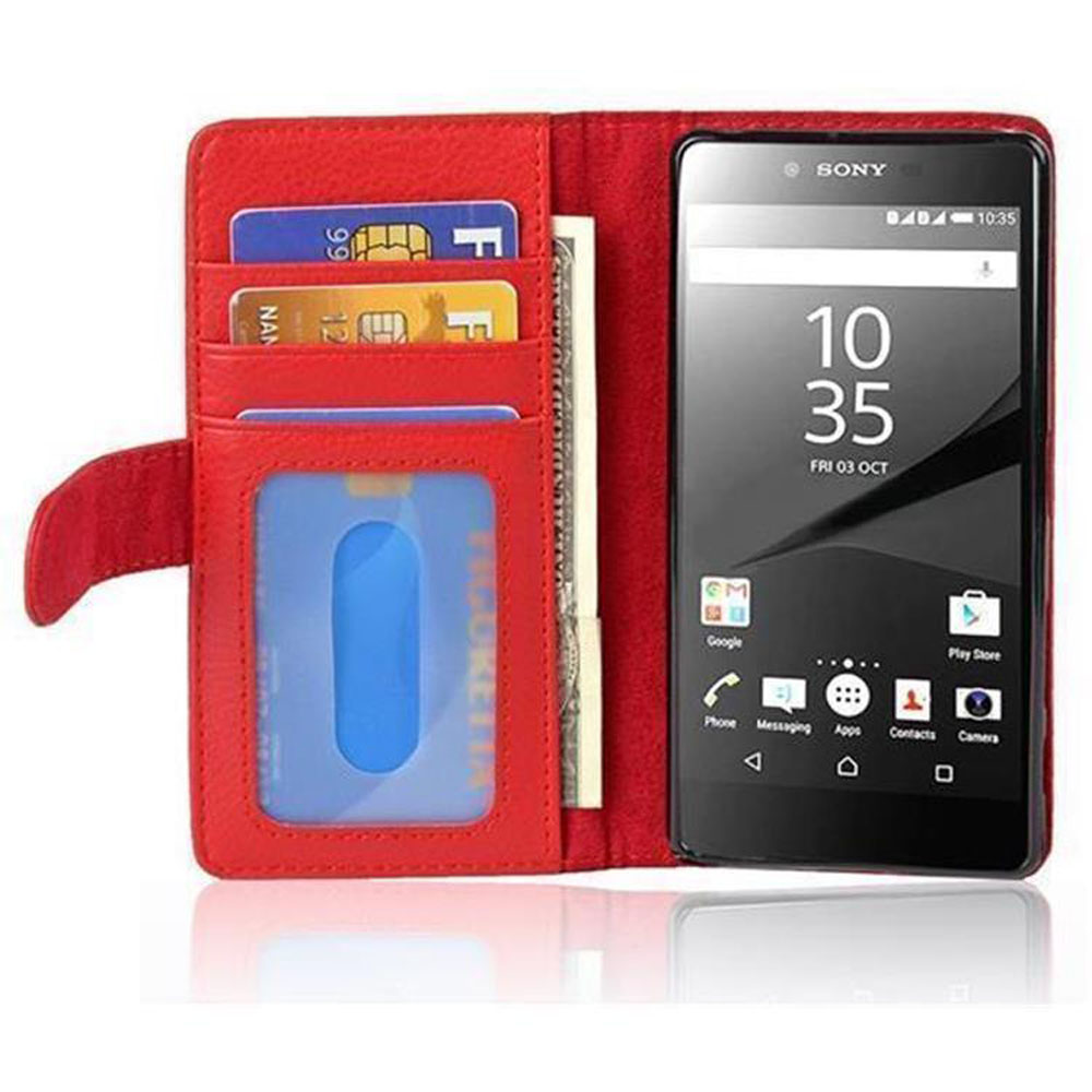 Portafoglio rosso per telefono aperto, che rivela telefono, carte di credito e contanti. Tutti i dettagli visibili.