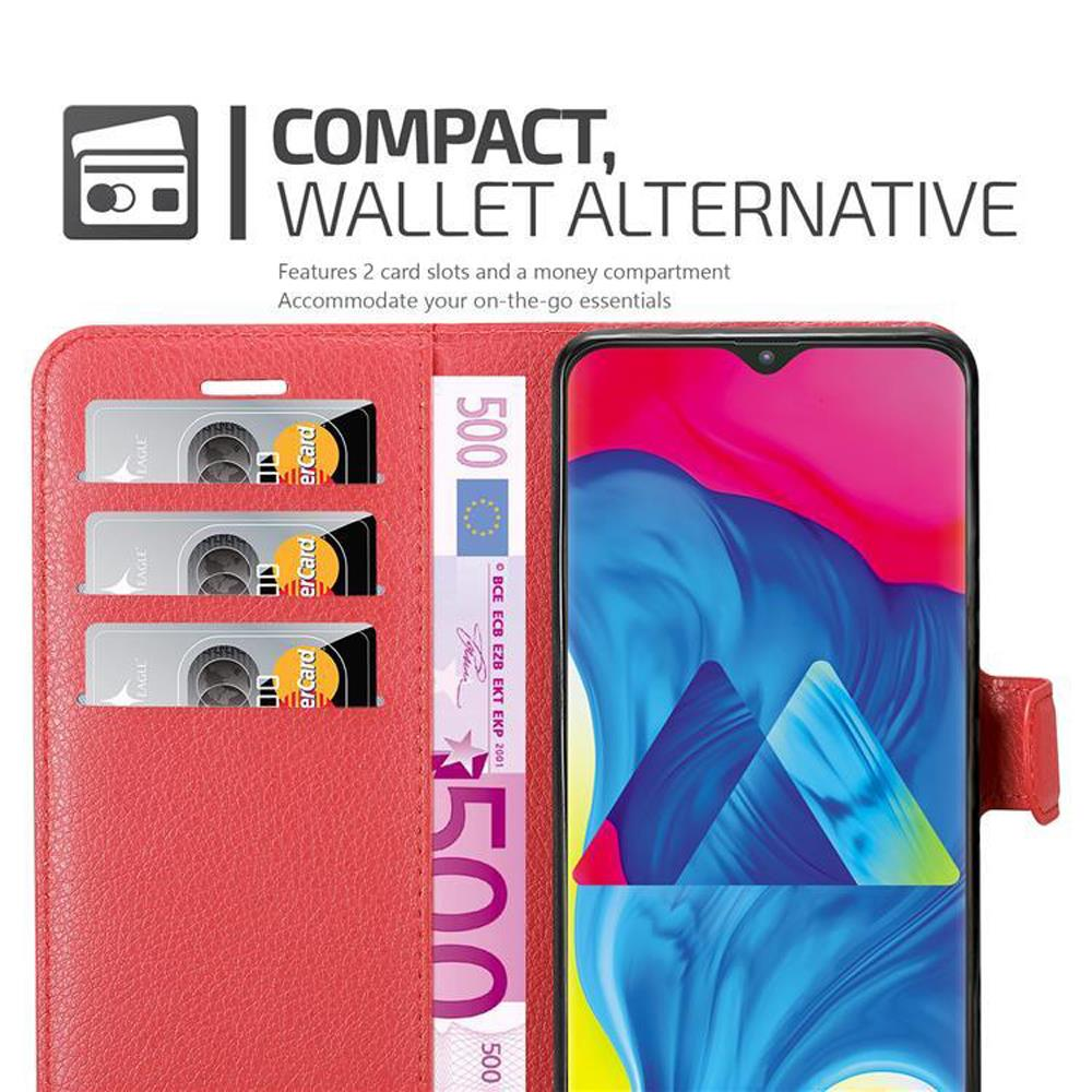 Eine rote Brieftaschen-Handyhülle, die geöffnet ist, um ein Telefon, Kreditkarten und einen 500-Euro-Schein zu zeigen.
