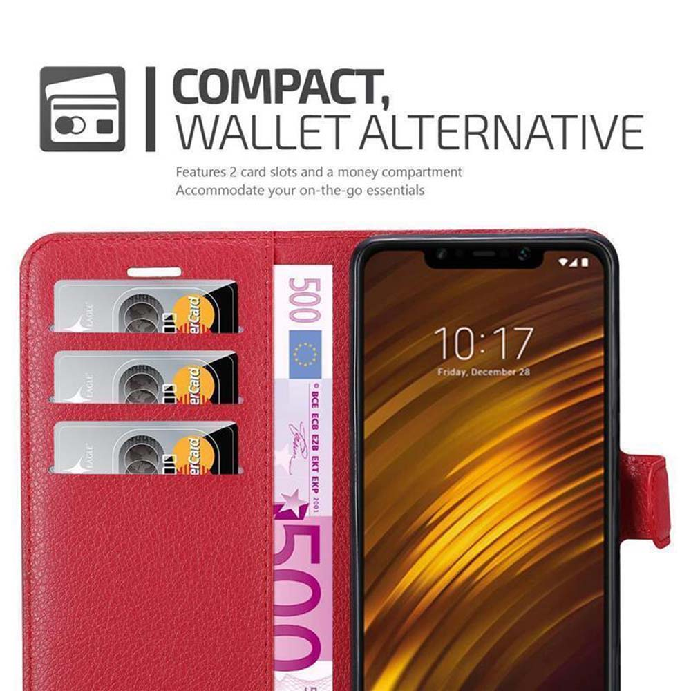 Custodia a portafoglio rossa con scomparti per carte e una banconota da 500 euro. Visibile un telefono con motivo dorato.