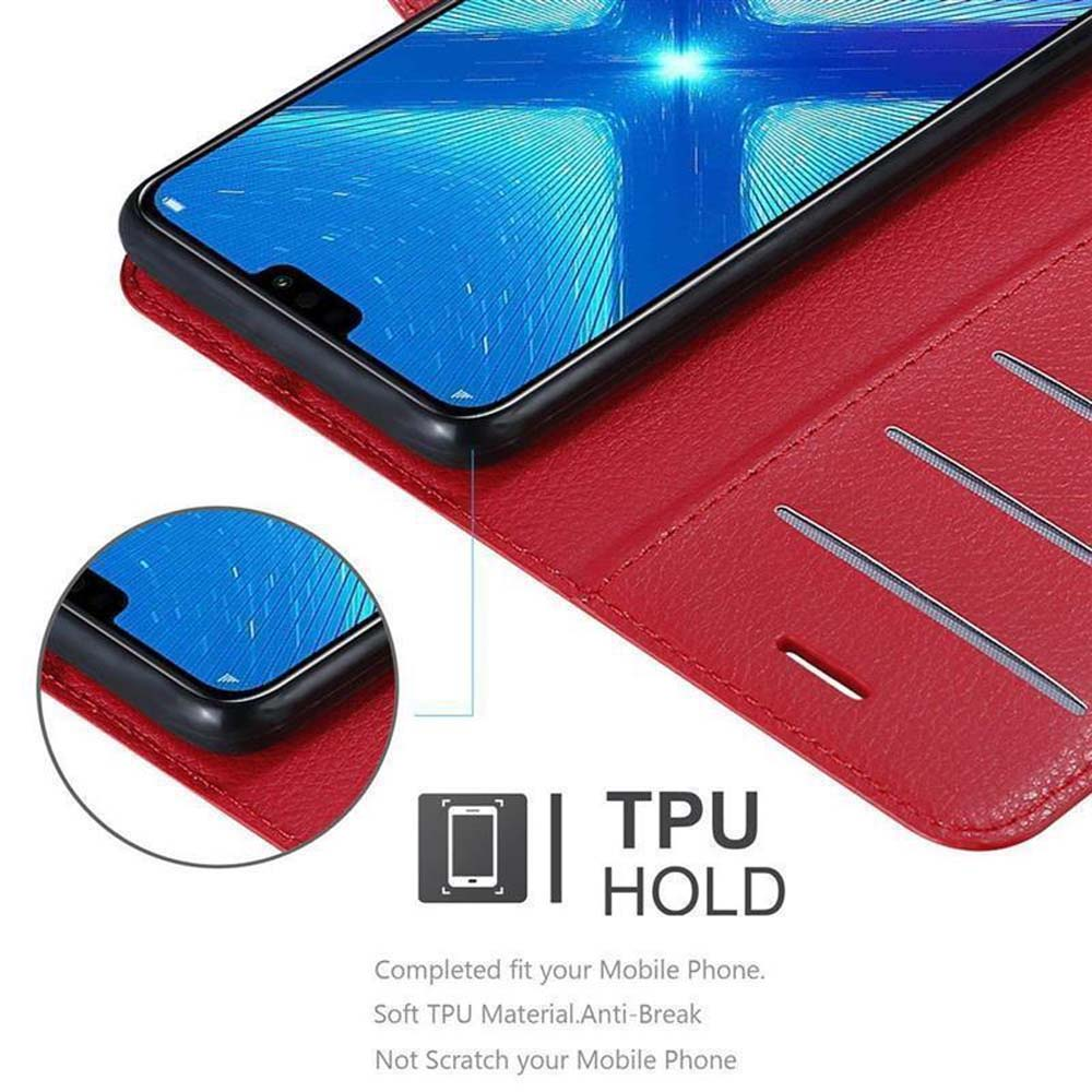 Un telefono all'interno di una custodia rossa. Il testo dice TPU HOLD. La custodia è aperta, mostrando lo schermo del telefono.