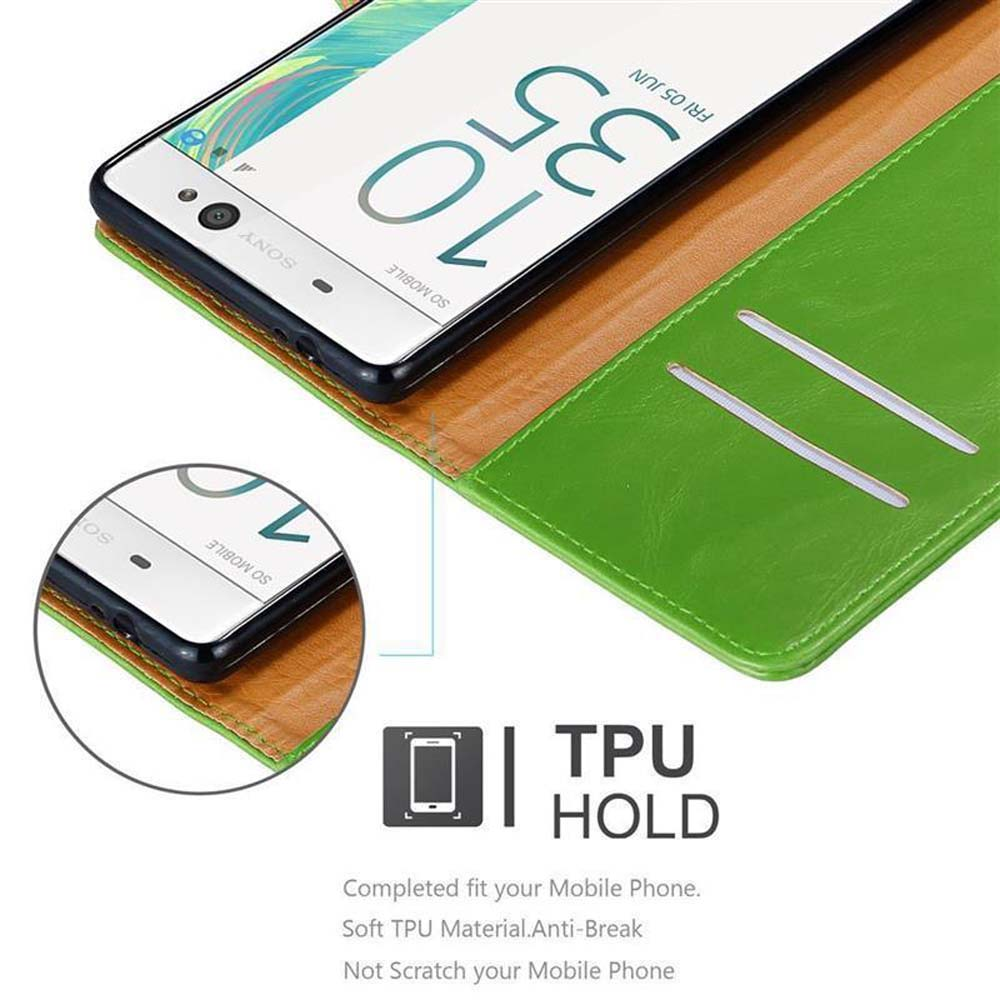 Un telefono con custodia verde aperta, con una custodia per telefono più piccola sotto.
