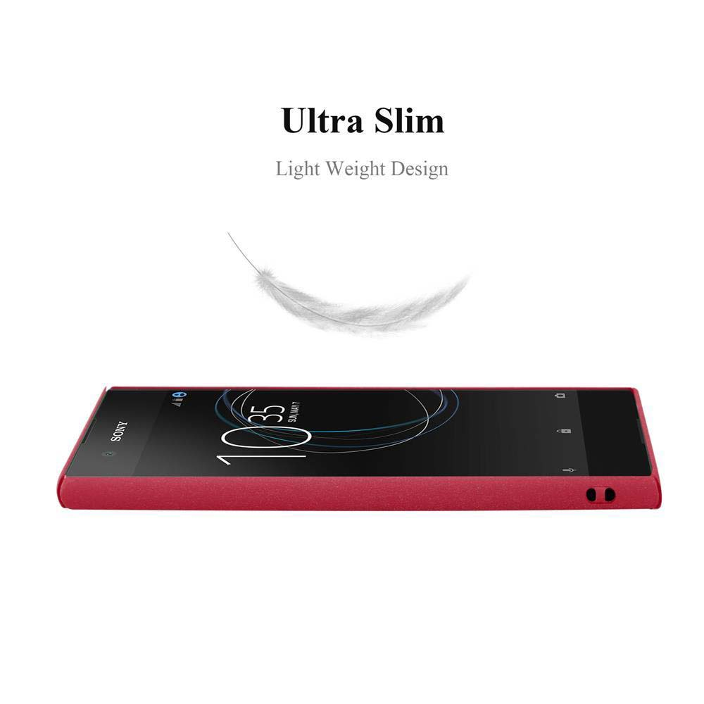 Ein rotes Telefon mit roter Hülle liegt auf einer Oberfläche, darüber eine schwebende Feder.