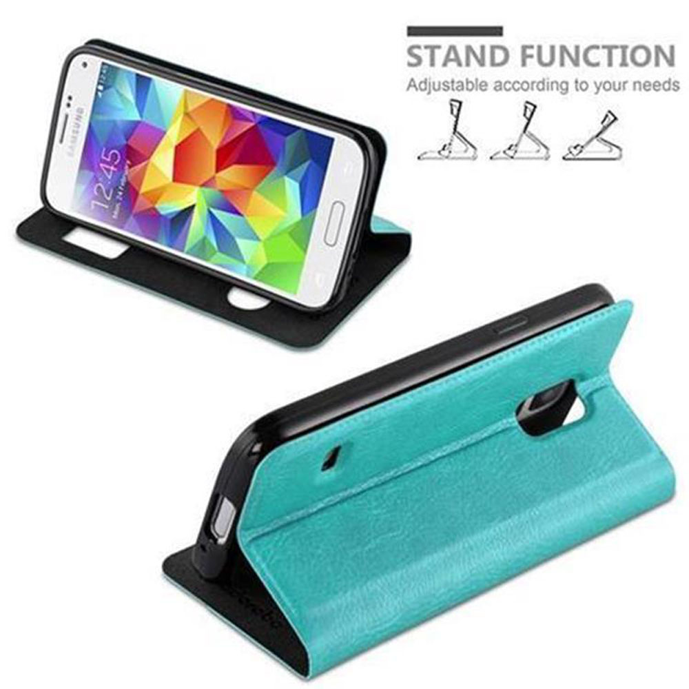 Teléfono en funda turquesa, abierto, apoyado. Texto: 'Stand Function'. Otra funda, cerrada.