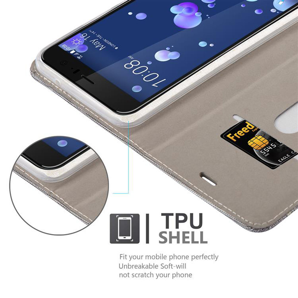 Telefono all'interno di una custodia beige con una carta. Testo: TPU SHELL. L'ora 10:08 AM è visualizzata.