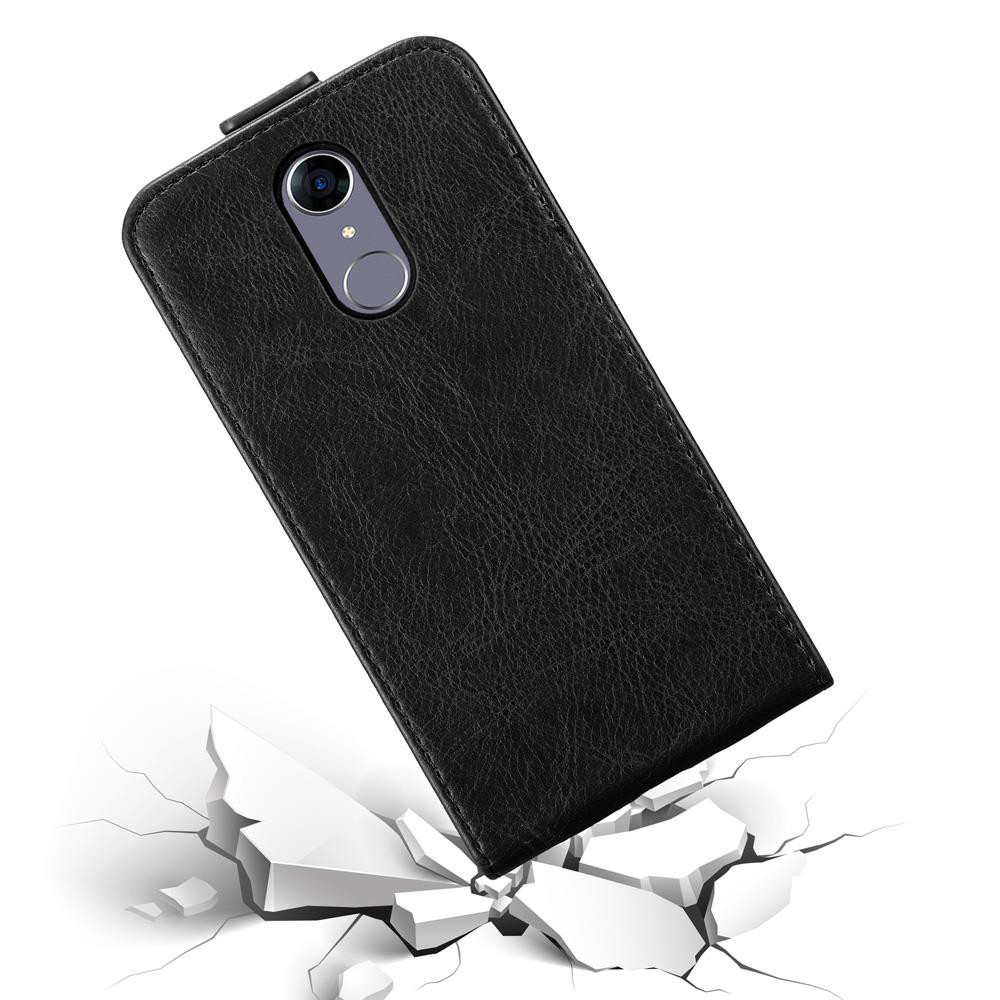 Eine schwarze Handyhülle mit einem Telefon, mit einem zerbrochenen Boden darunter.