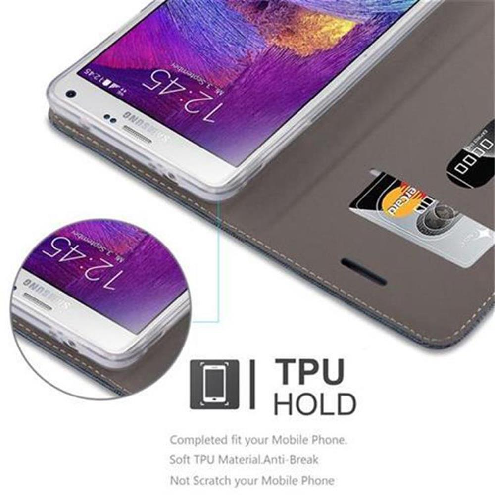 Telefono in una custodia marrone, con carte, e viene visualizzato il testo 'TPU HOLD'.