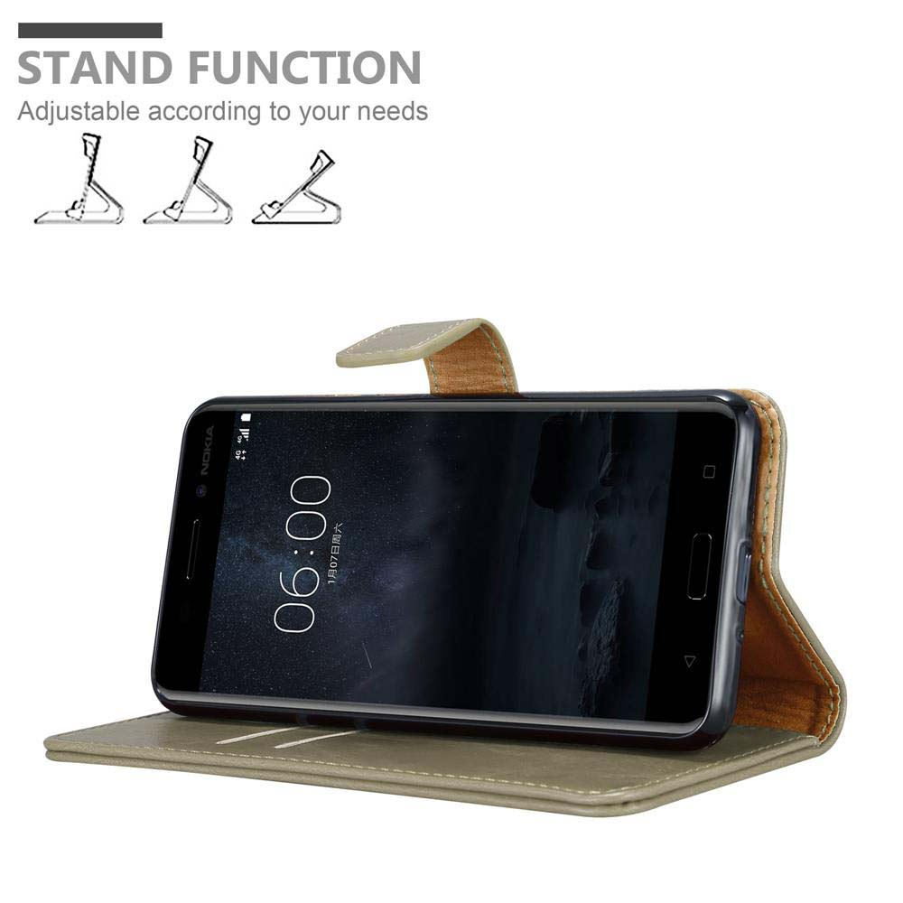 Telefono in una custodia beige, funzione supporto. Testo: Funzione supporto. Il telefono mostra 06:00 AM.