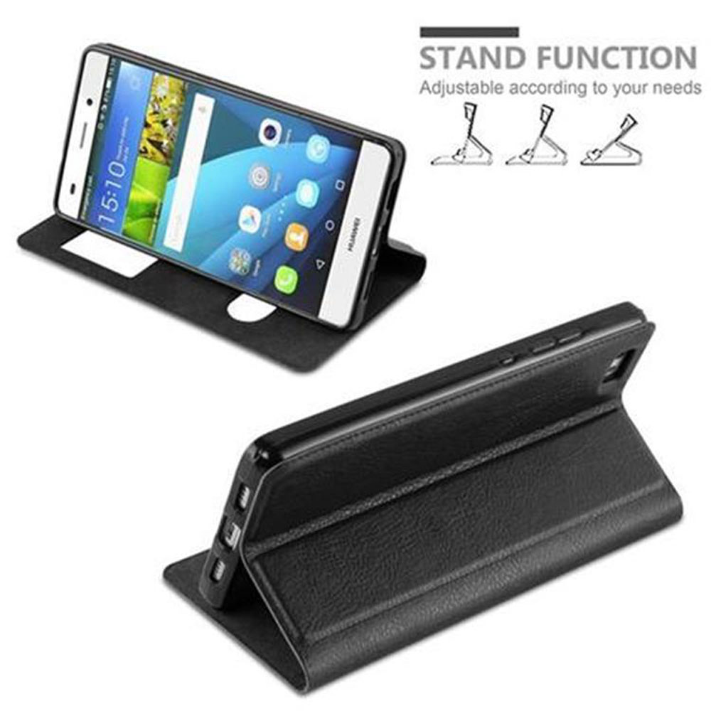 Un teléfono en una funda negra, con función de soporte, sobre una mesa.