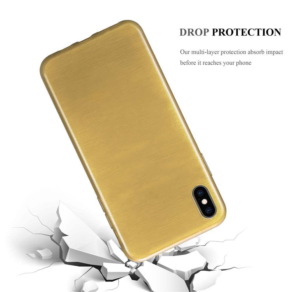 Goldene Handyhülle. Die Hülle befindet sich über einer zerbrochenen Betonoberfläche. Fallschutz. Das Telefon ist goldfarben.