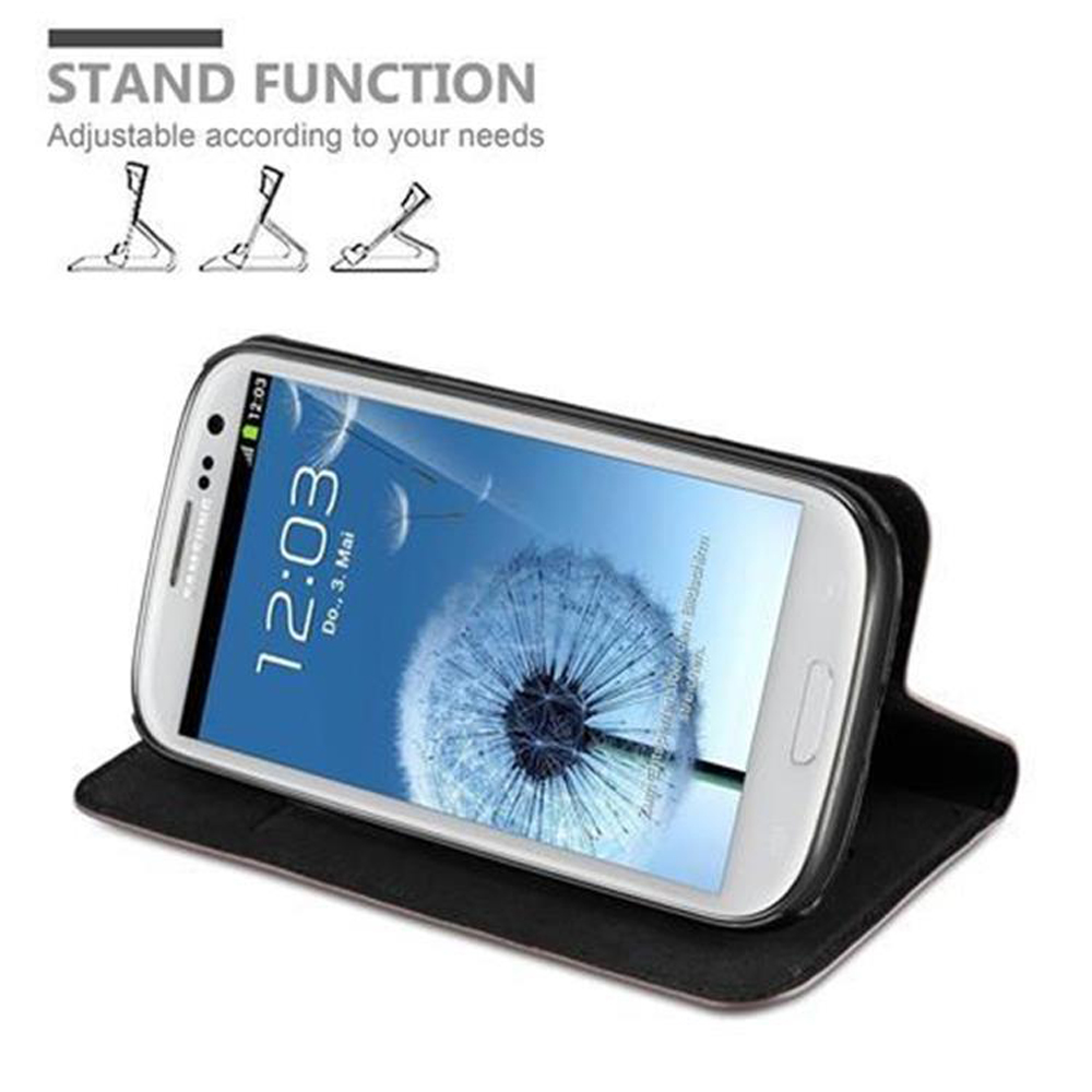 Teléfono blanco en una funda negra, sobre una superficie. El texto dice función de soporte y muestra configuraciones.