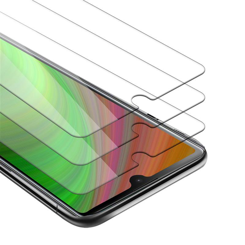 Tre protezioni schermo su un telefono, ciascuna parzialmente staccata, vista ravvicinata.