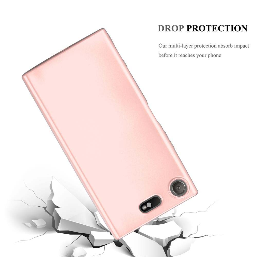 Un telefono rosa su una superficie rotta.