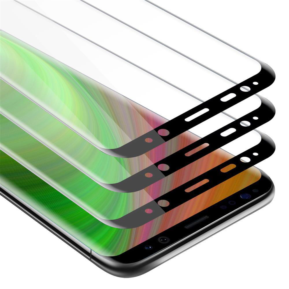 Protezioni schermo impilate su uno schermo del telefono, che mostrano colori vibranti con bordi neri. Il telefono è su una superficie bianca.