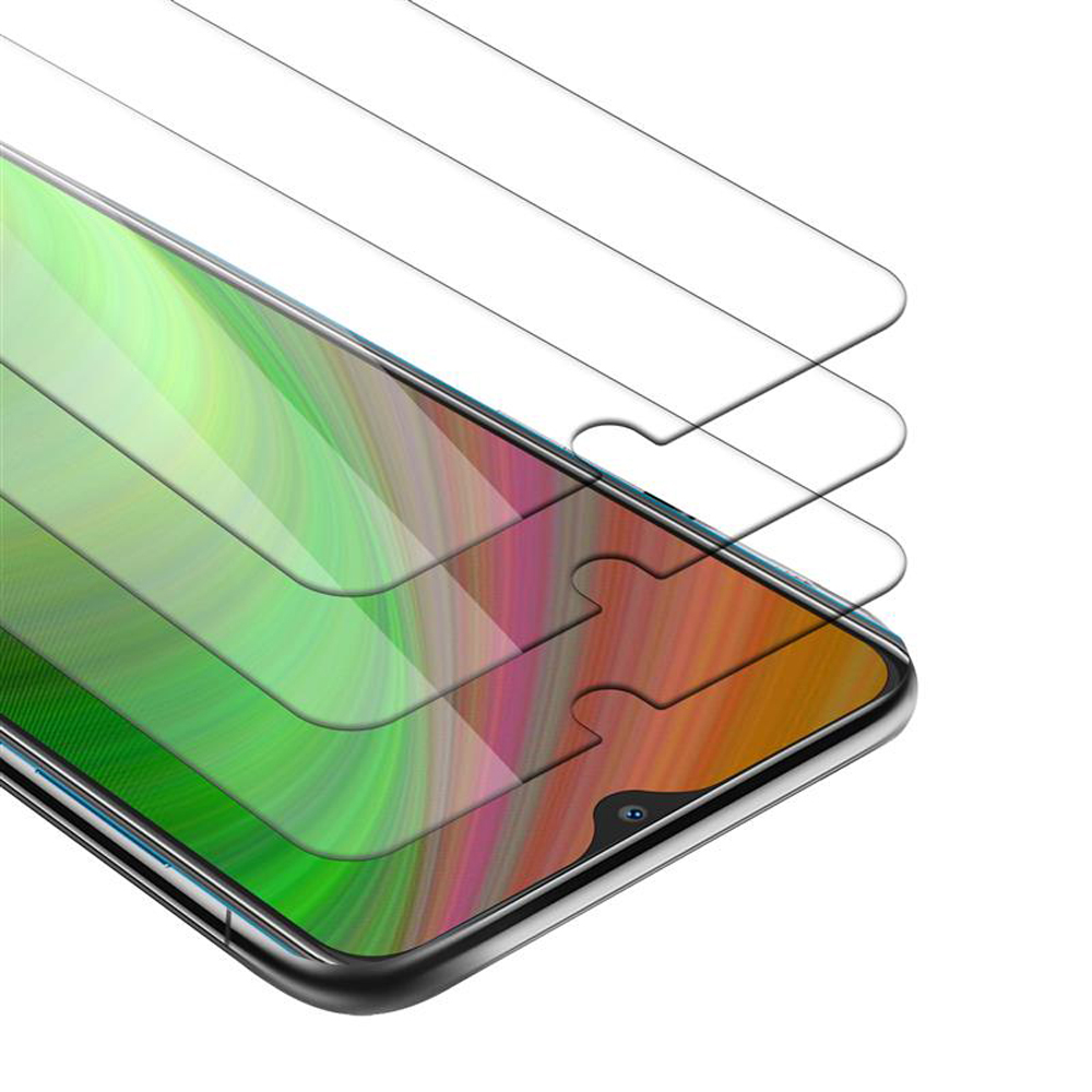 Uno smartphone con tre protezioni per lo schermo sopra. Il telefono mostra uno sfondo astratto colorato.