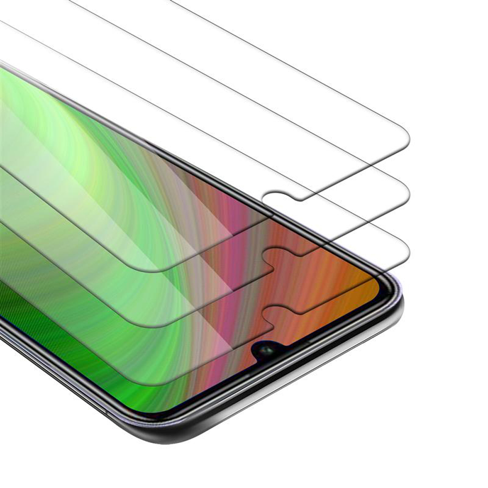 L'immagine mostra un telefono con una protezione per lo schermo applicata. Diverse protezioni per lo schermo sono impilate sul telefono.