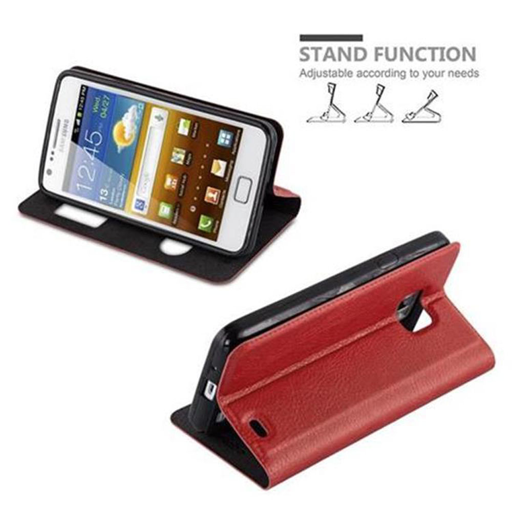 Dos teléfonos en funda roja que puede ser un soporte. Uno muestra la hora. Función de soporte.