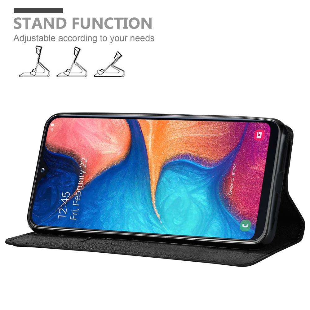 Un teléfono en una funda negra, apoyado. La pantalla muestra una imagen abstracta.