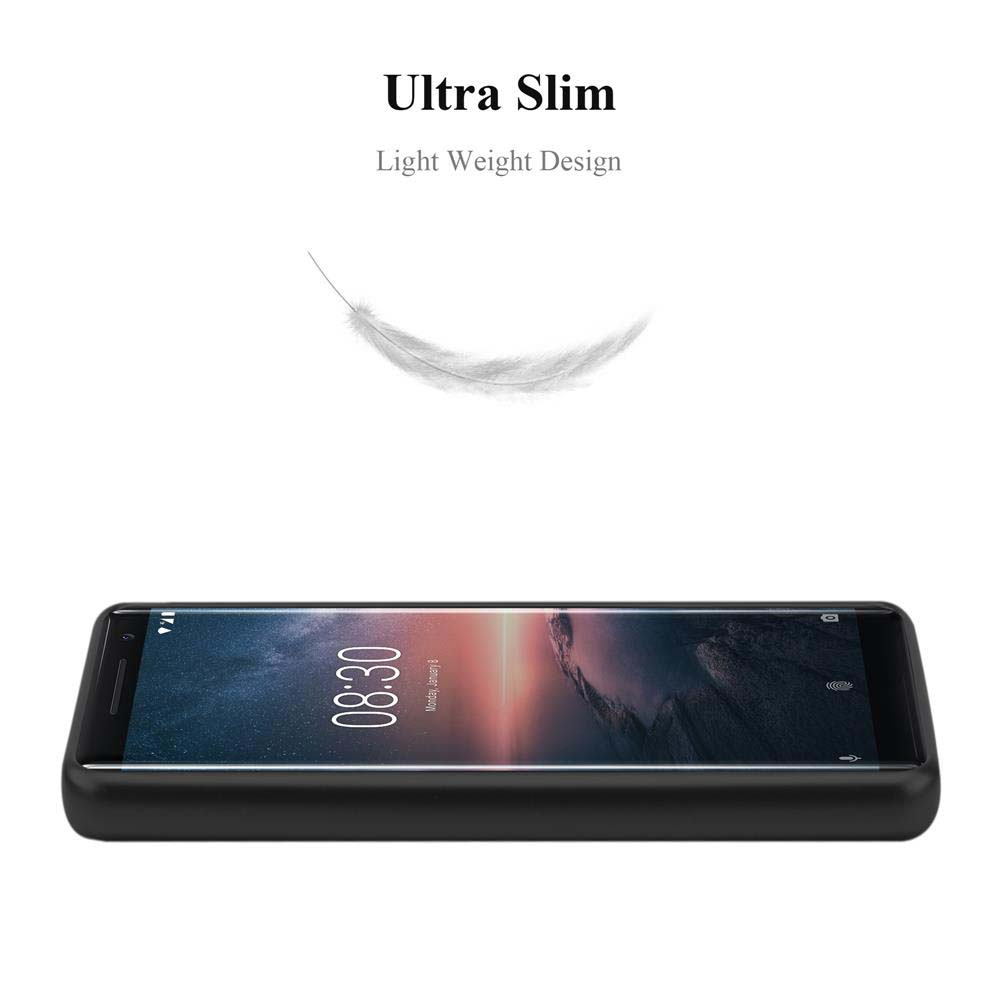 Schwarzes Telefon auf weißem Hintergrund. Leichte Feder darüber. Telefon zeigt Uhrzeit und Datum.