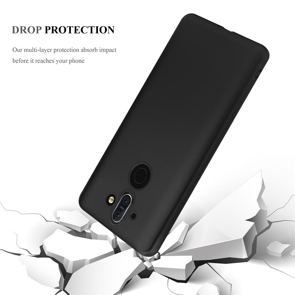 Ein schwarzes Telefon in einer Hülle über einer zerbrochenen Oberfläche. Der Text lautet 'DROP PROTECTION'.