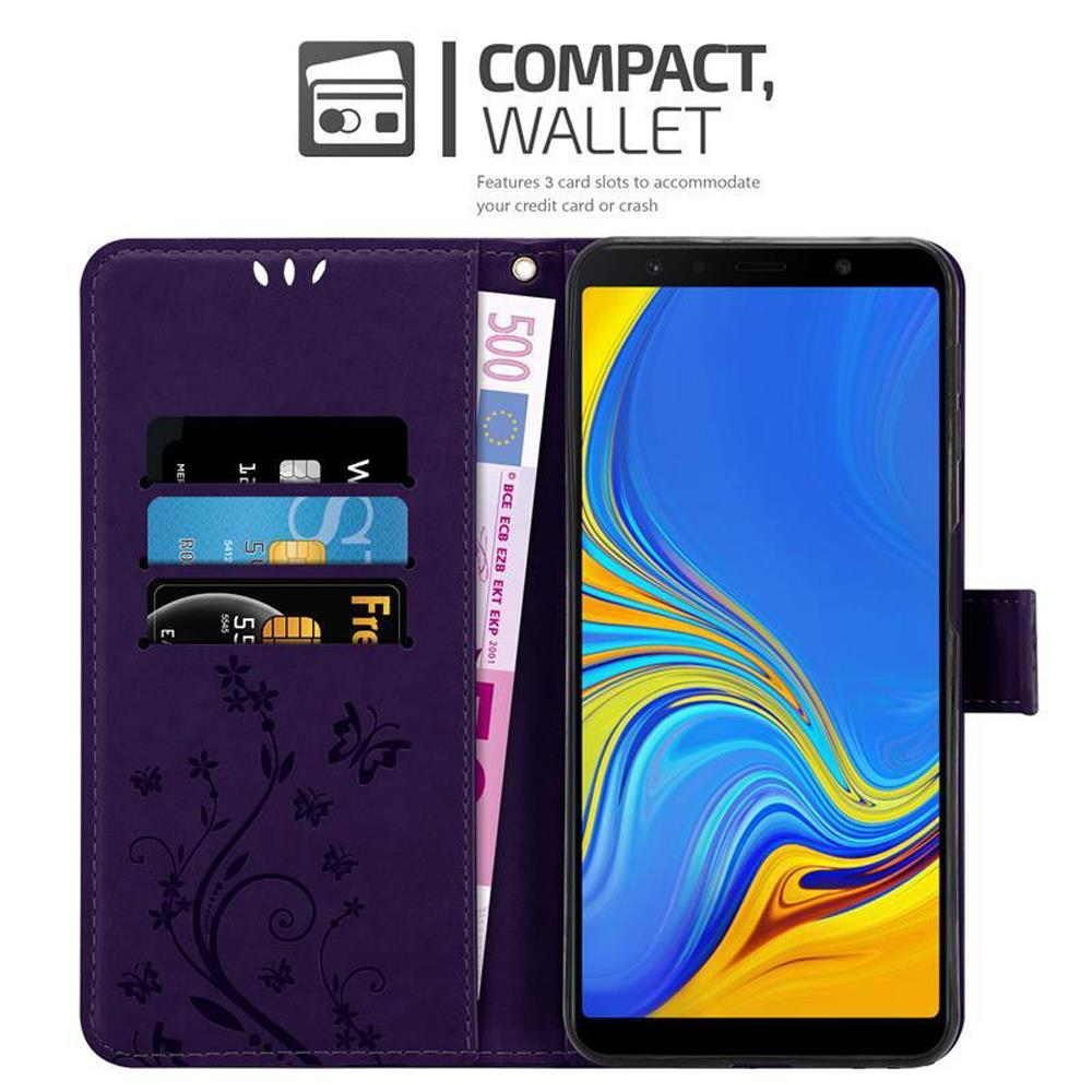 Custodia a portafoglio viola per telefono con carte di credito e banconota da 500 euro. Telefono visibile all'interno.
