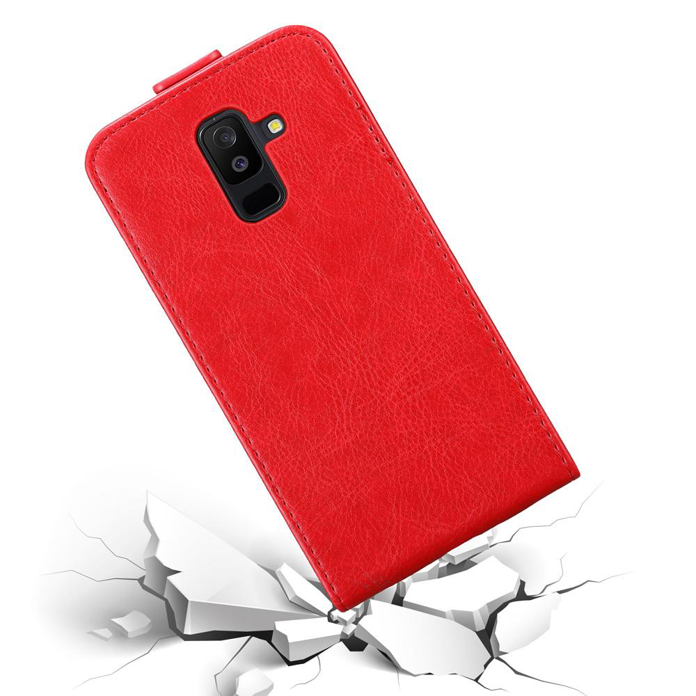 Una custodia rossa per telefono su blocchi bianchi rotti. La fotocamera è visibile.